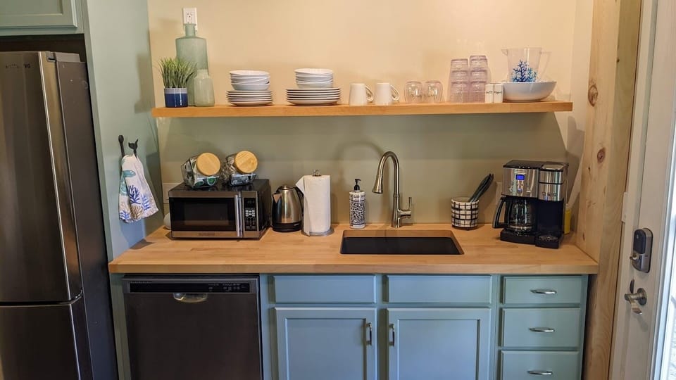 Lower level kitchenette with full size fridge and dishwasher