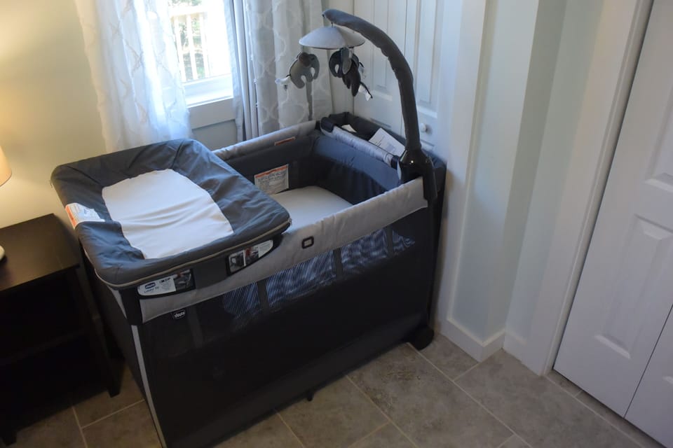 Chicco playard with bassinet and
changer stored in bedroom closet