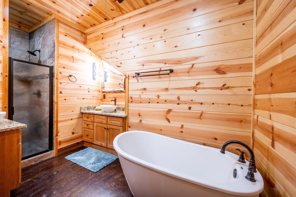 Enjoy a relaxing bath in the primary bedroom soaking tub.