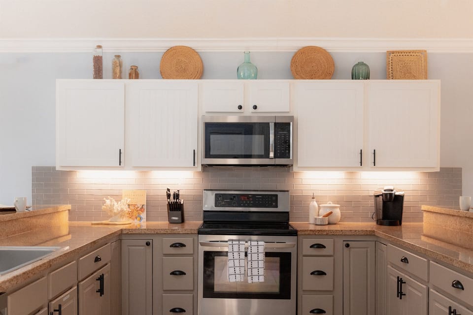 Fully stocked kitchen with modern appliances and everything needed for easy vacation meals.