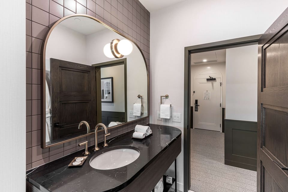 Room, 1 King Bed, Corner (Savour) | Bathroom | Hair dryer, bathrobes, towels, soap