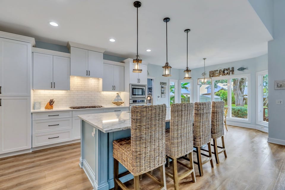 Chef's kitchen with large island and seating for four