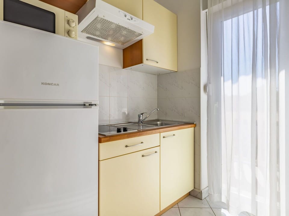 Cabinetry, Property, Building, Sink, Countertop, Tap, Kitchen, Interior Design, Kitchen Appliance, Wood