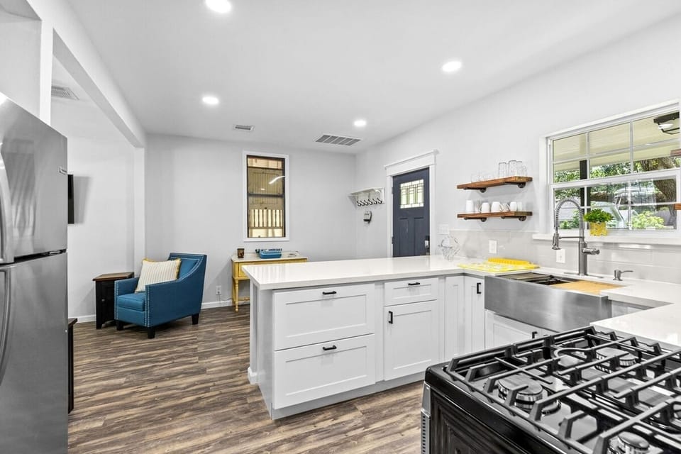 Tlk about modern- this home features self-closing drawers, recessed lighting, very clean, stainless steel appliances with a 5 burner gas stove/range