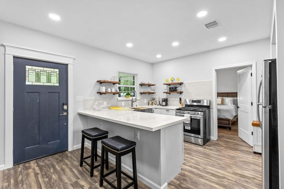 2 stools for dining on quartz counter and another vantage point to get an idea of layout