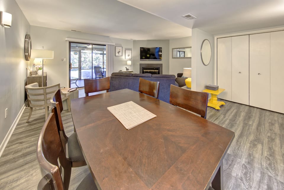 Dining area with living room in background