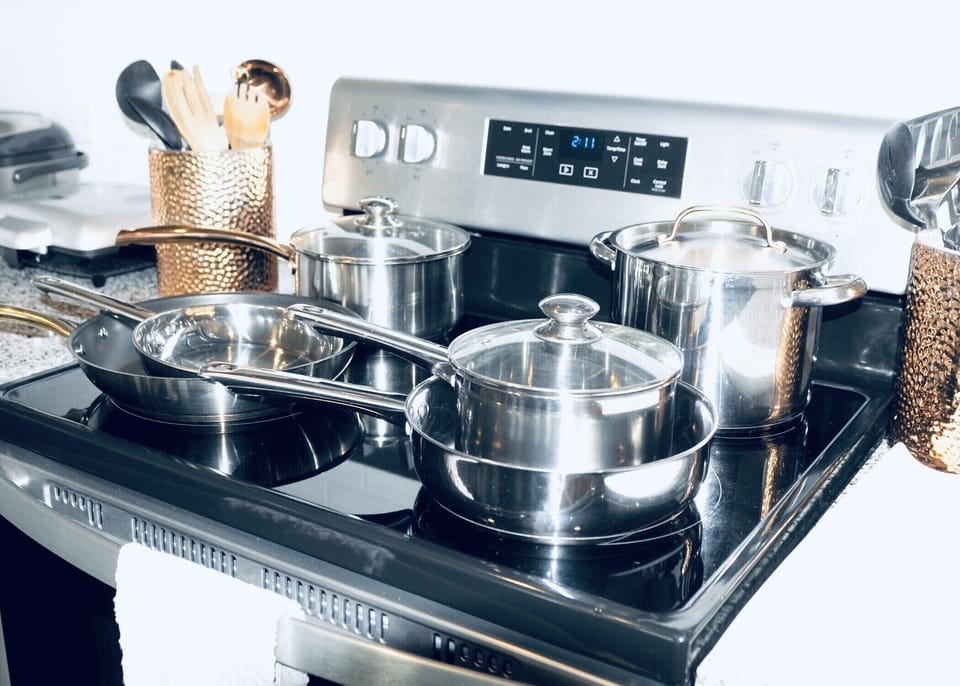 Walk-in pantry. LOTS of pots/pans/appliances/cooking gadgets. Plastic-wares  too