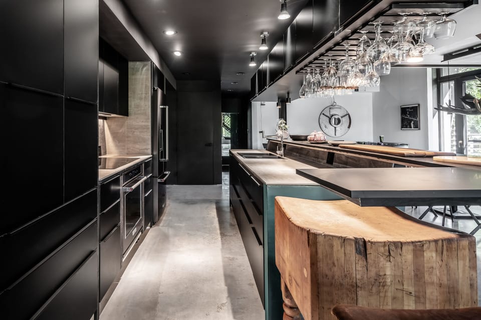 modern design kitchen, open to the living space, with bar/ photo: Derek Walker
