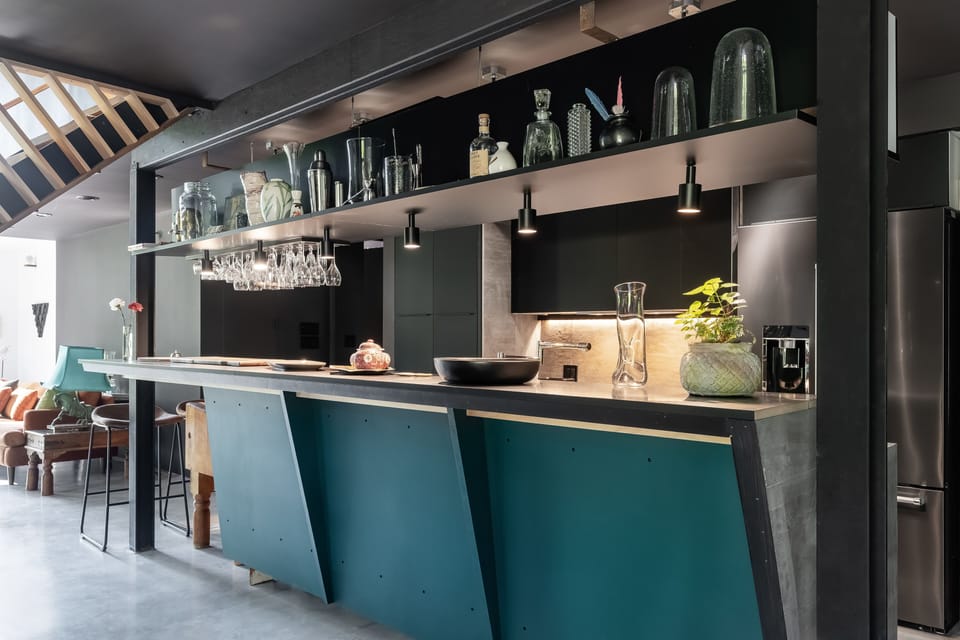 modern design kitchen, open to the living space, with bar/ photo: Derek Walker