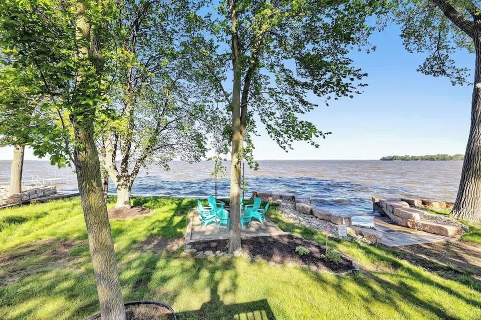 Looking down from the deck at the fire pit area. Launch to the right is the neighbor's but they allow us to launch our kayaks from there!