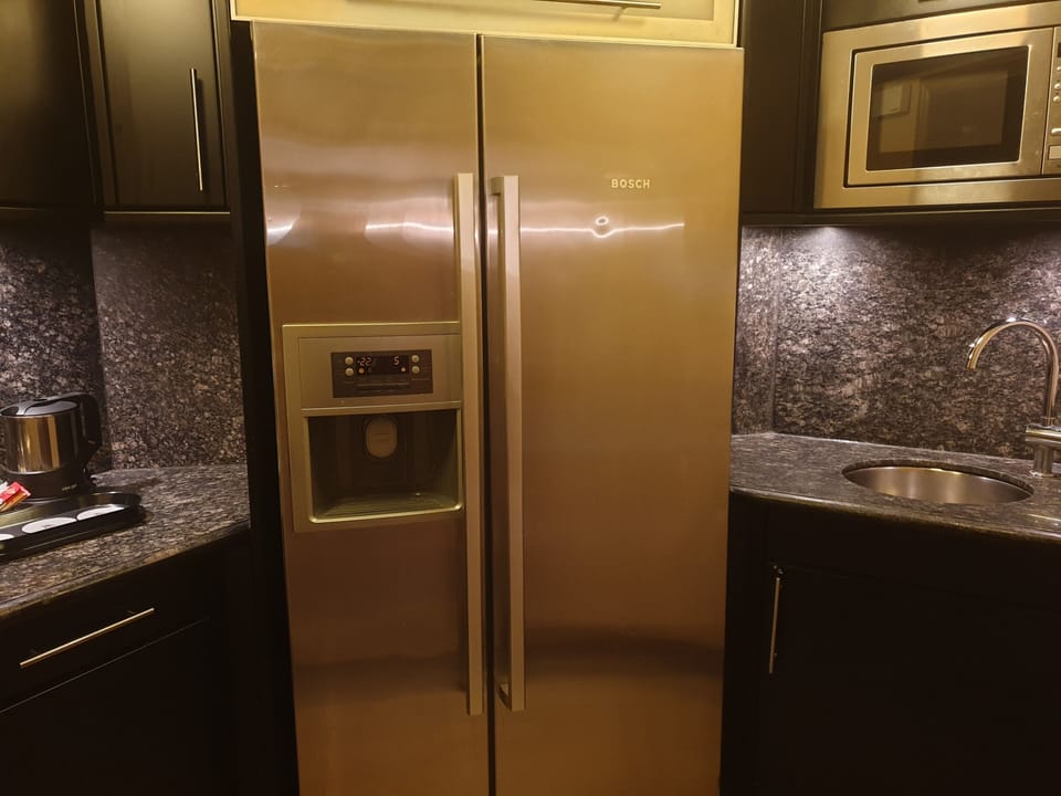 Presidential Suite, 1 King Bed, Balcony | Private kitchen | Eco-friendly cleaning products