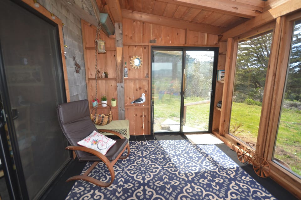 Sun room with sliding glass door to outside.