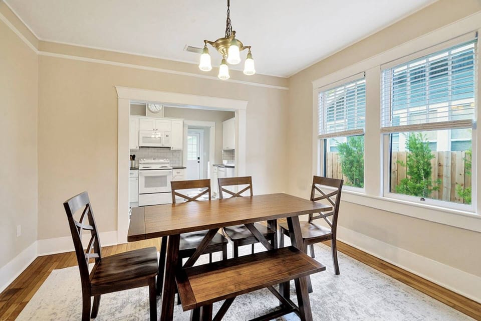 This open floor plan allows the chef to prepare a tasty meal and serve it at this beautiful dining room table that seats 6 comfortably.