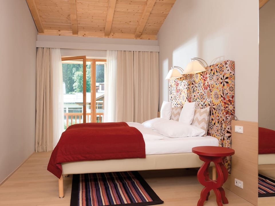 Hypo-allergenic bedding, desk, laptop workspace, blackout drapes