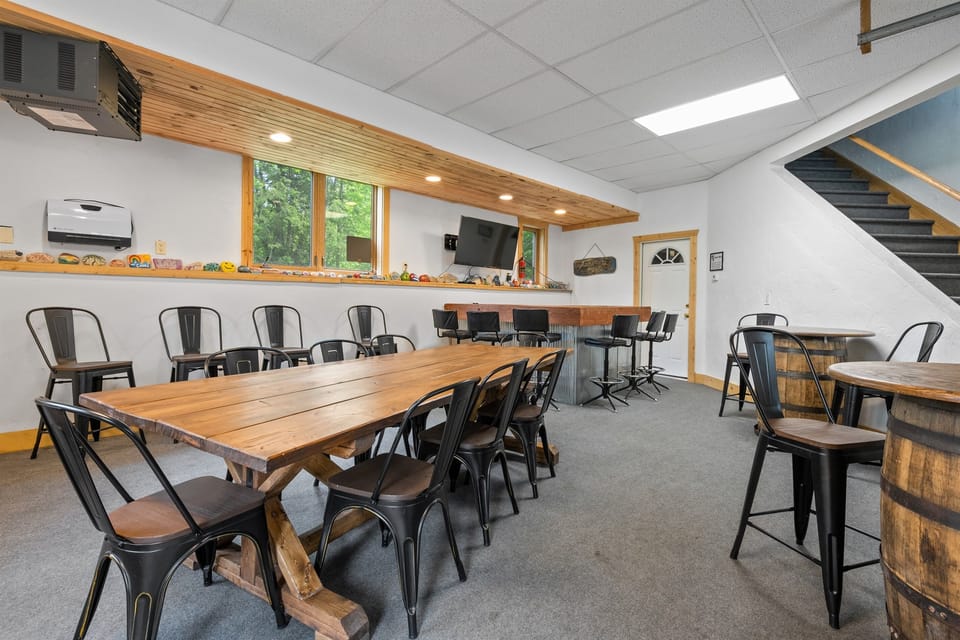 Bar Room! With pub tables, fridge, TV, and a large farmhouse dining table