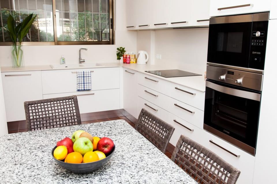 Deluxe Apartment | Private kitchen | Full-size fridge, oven, dishwasher, coffee/tea maker