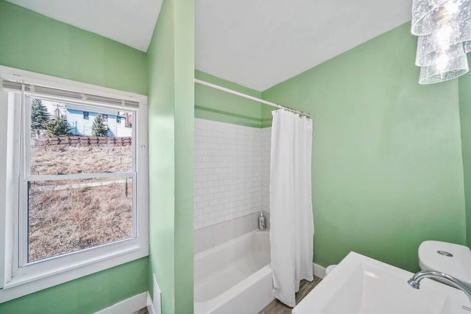 Full size bath with closet upstairs.  Bath stocked with shampoo, conditioner and body wash.  Floor slants!