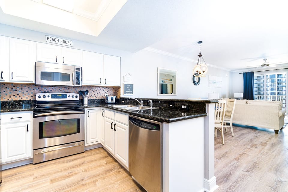 Fully stocked kitchen with stainless steel appliances