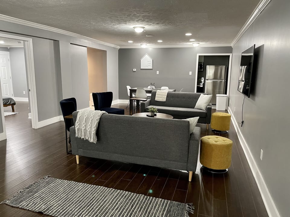 Living room and dining area. Plenty of seating around the 65 inch TV!