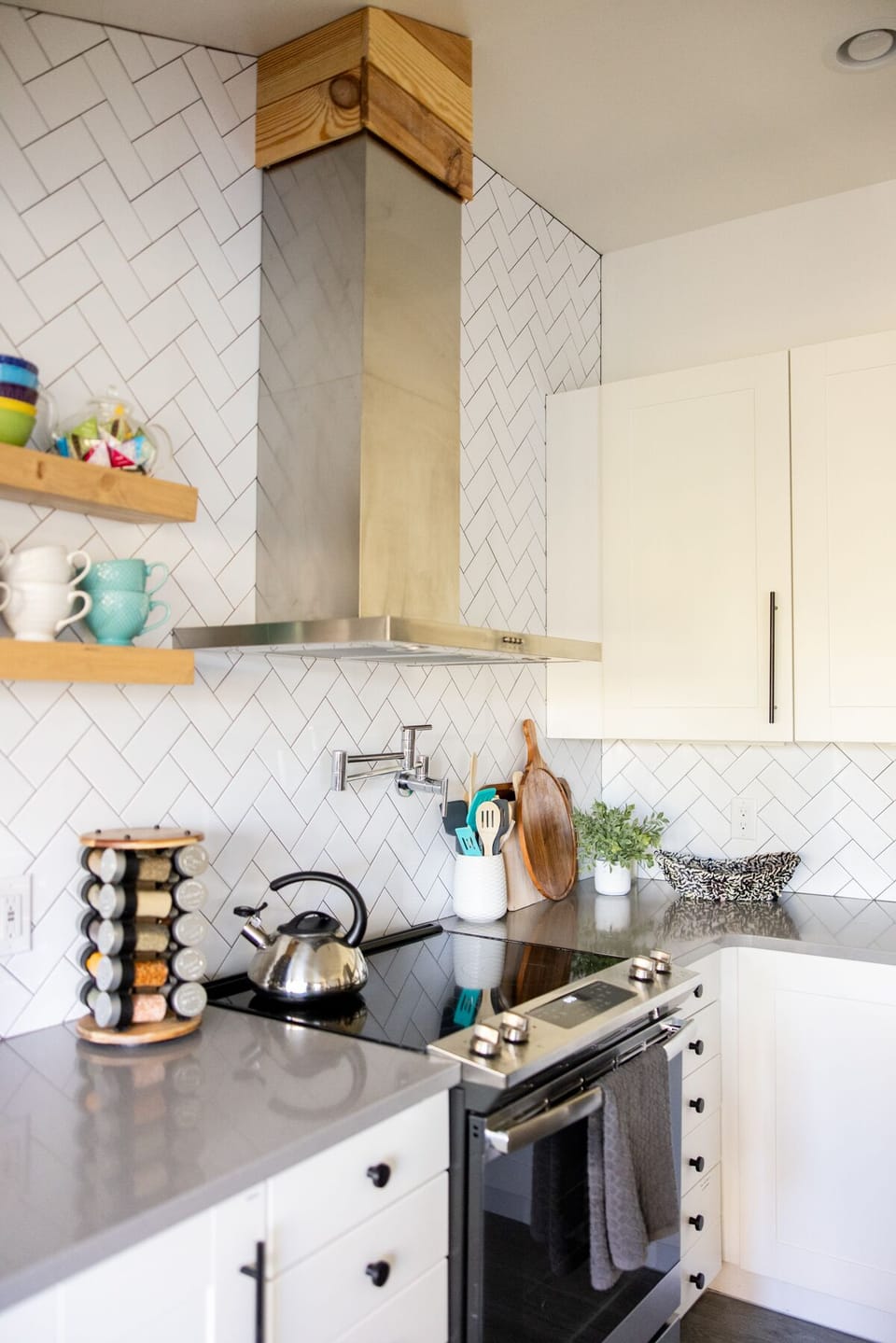 Kitchen, glass cooktop stove, pot filler and hood