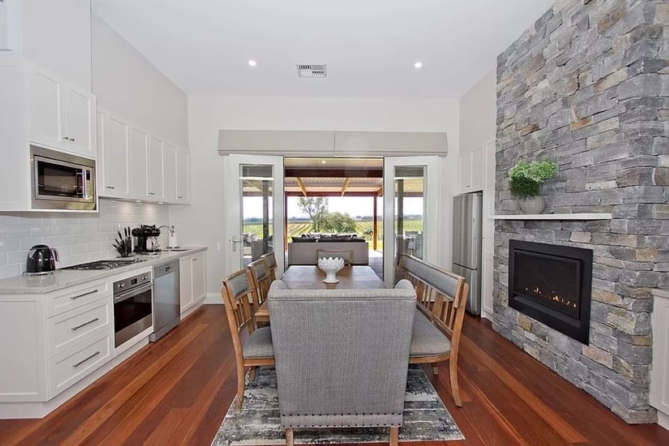 Fine Acres Estate - kitchen & dining table - featuring gas fire - 'Chizen' suite