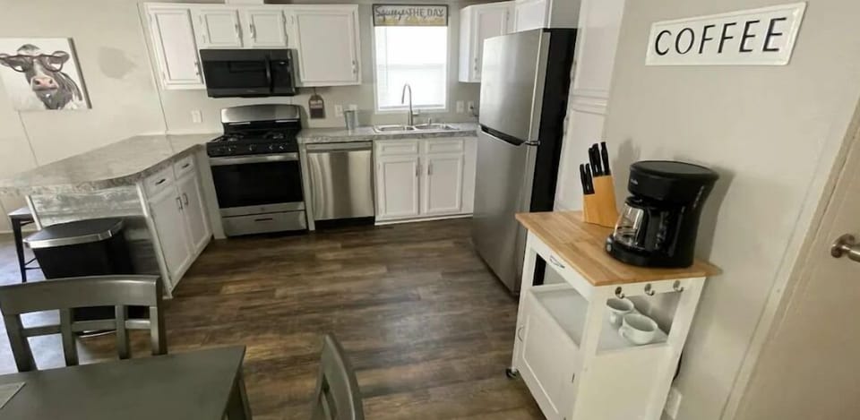 full kitchen with everything you need. pots, pans, dishes, glasses, dishwasher