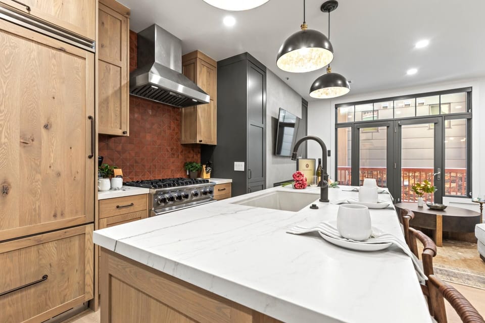 Custom cabinetry and sleek appliances blend form and function for easy at-home meals.