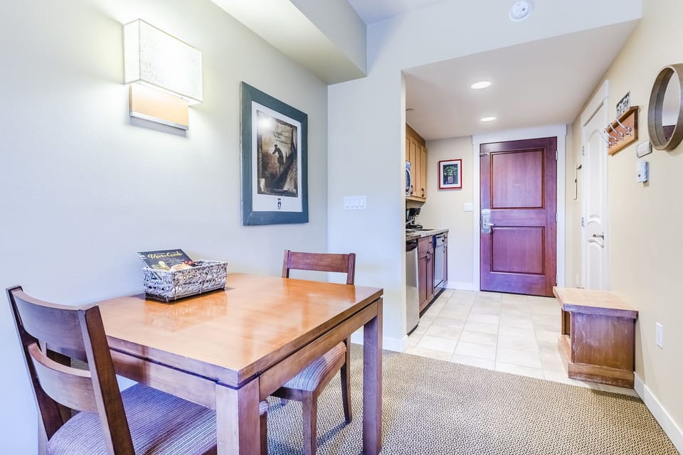Dining Area - Dining Area- Quaint dining table with seating for two guests.