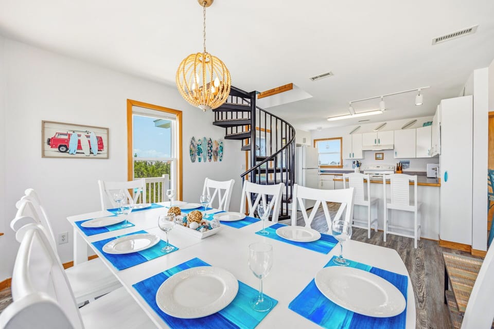 Gather around this bright, beach-themed dining table where meals become memories. Sunlight pours in, the ocean view beckons, and your fully-equipped kitchen awaits to make every morning and evening feel special.