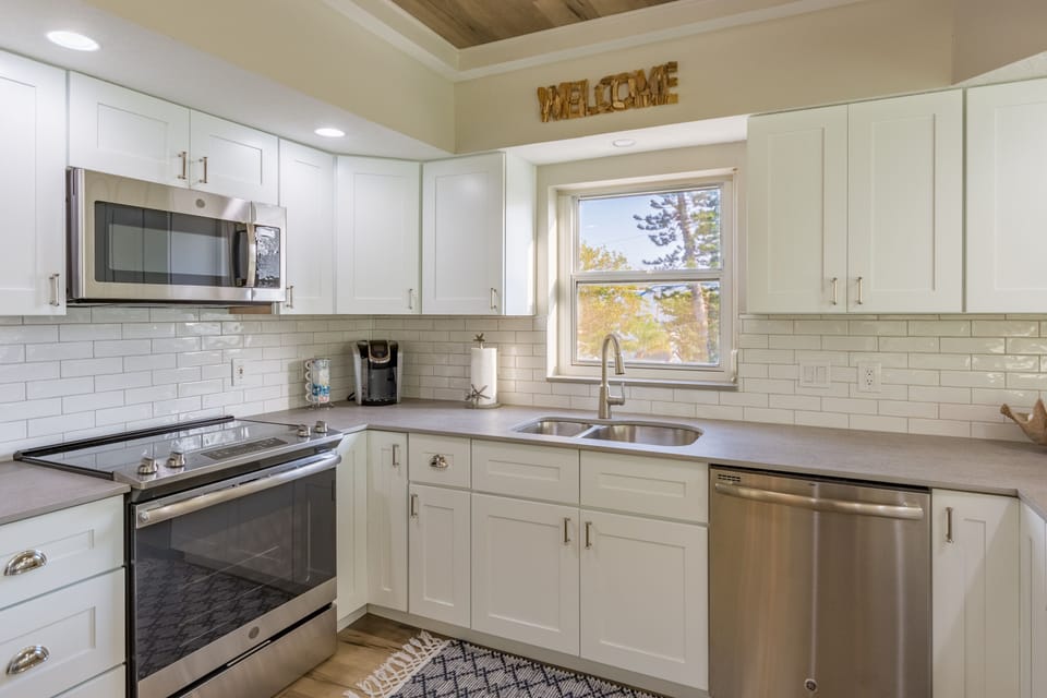 Kitchen includes a microwave and dishwasher