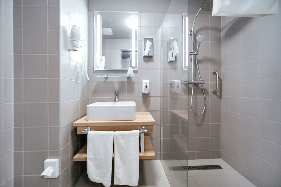 Shower, free toiletries, hair dryer, slippers