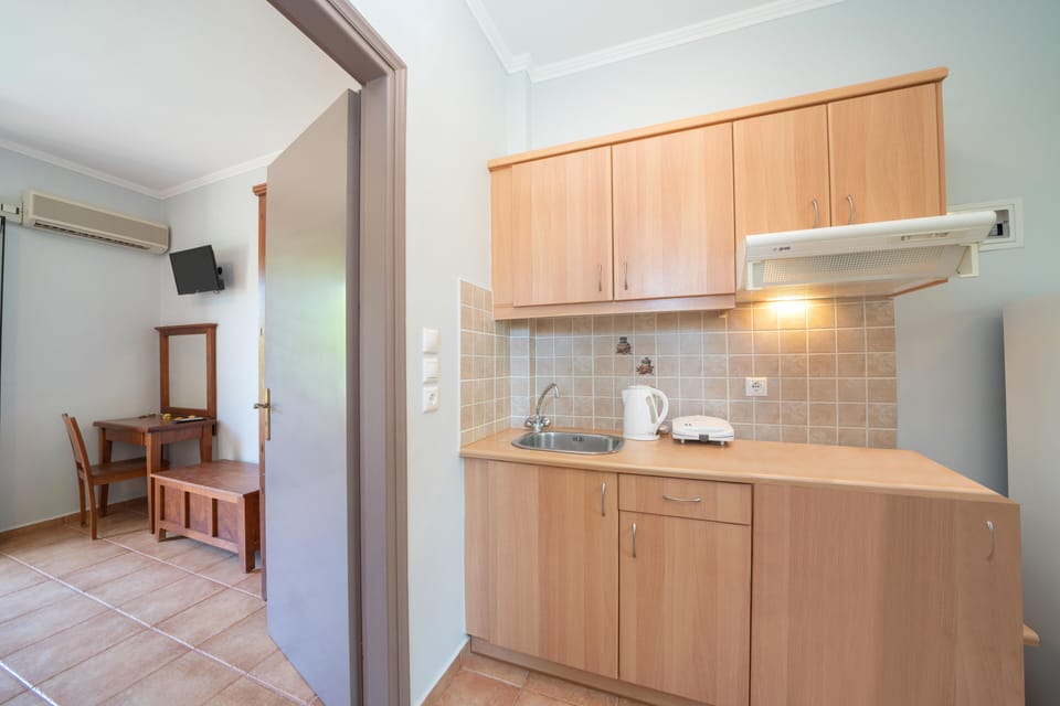 Mini-fridge, electric kettle, toaster, cookware/dishes/utensils