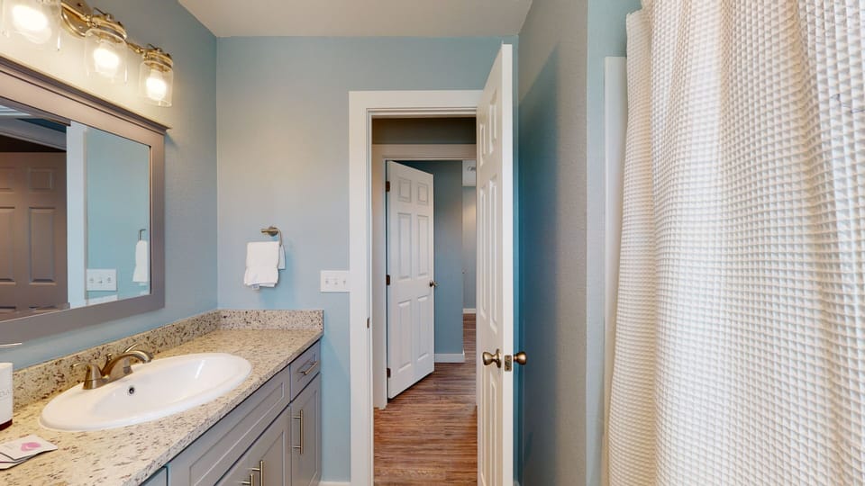 Shared Bathroom with Tub/Shower Combo