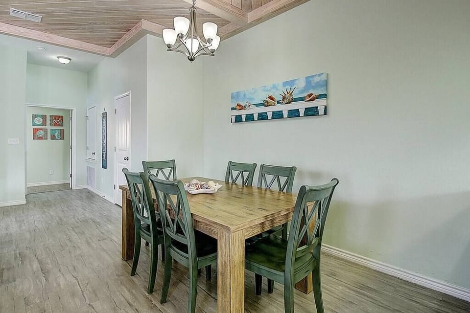Indulge in shared meals at our expansive dining table, accommodating six guests, with additional seating available along the bar for convenience and camaraderie.