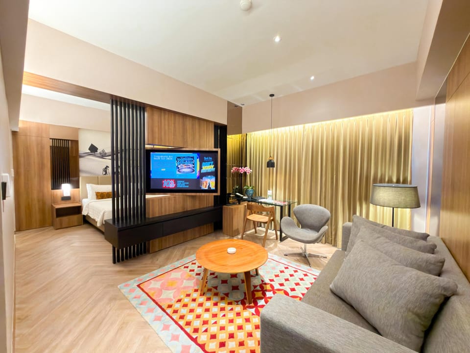 Junior Suite, 1 King Bed | Living area | LCD TV