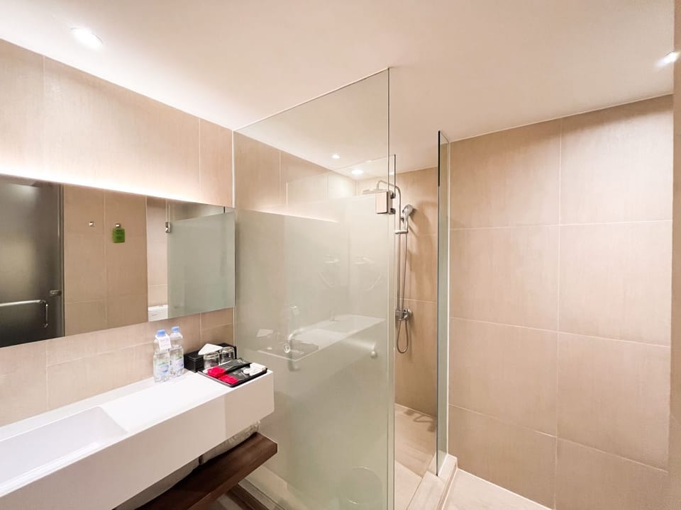 Family Room, 2 Queen Beds | Bathroom | Free toiletries, hair dryer, bathrobes, slippers