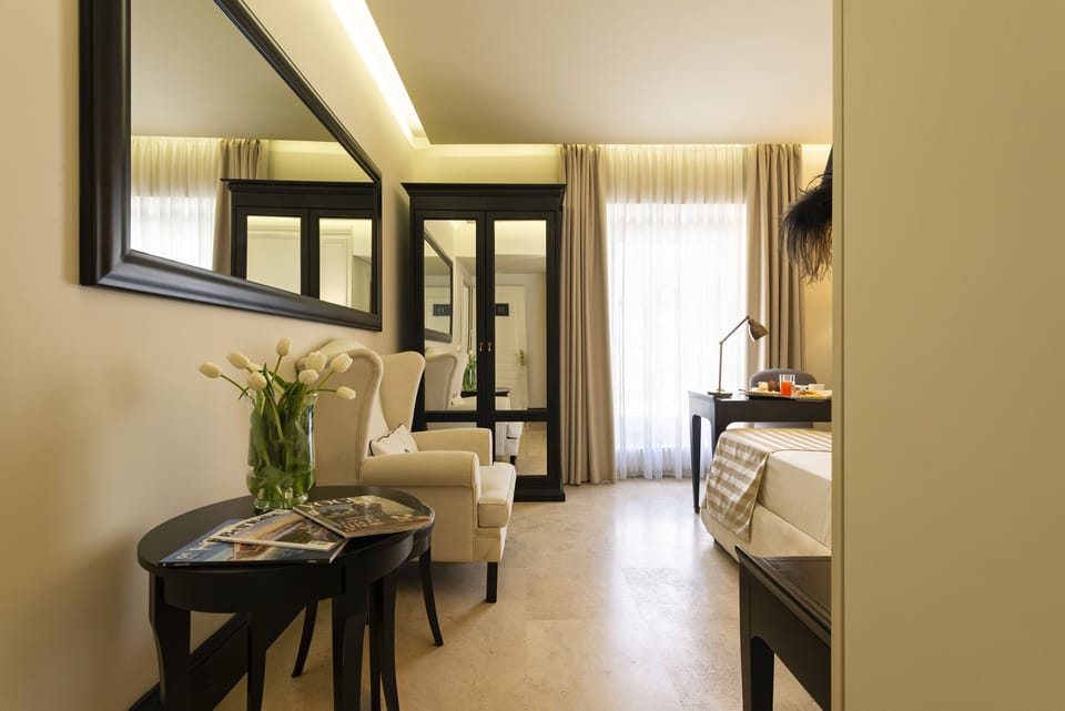 Premium bedding, down comforters, minibar, in-room safe
