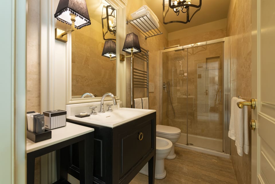 Superior Room | Bathroom | Designer toiletries, hair dryer, towels, soap