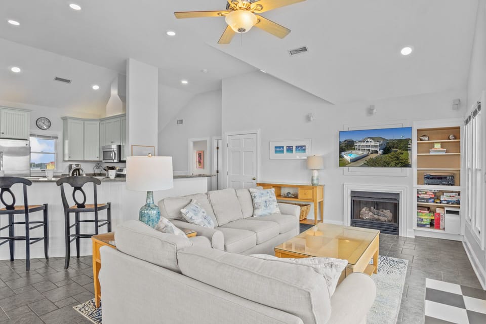 There's plenty of comfortable seating for everyone around the large TV in the great room.