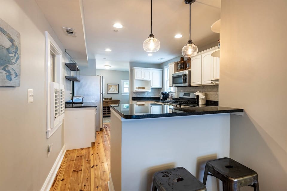 View into the kitchen from the breakfast bar, with seating for 2.