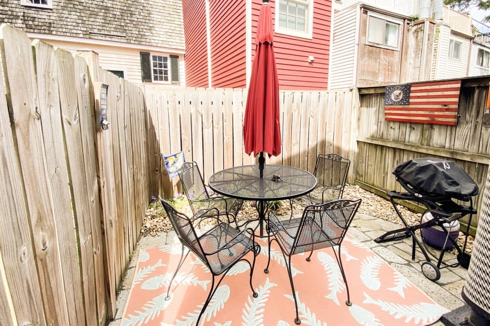 Soak in the sunshine in the private fenced-in back patio has with a grill and seating for 4.