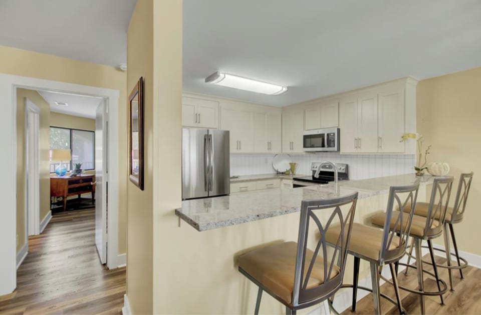 Kitchen with breakfast bar seating.
