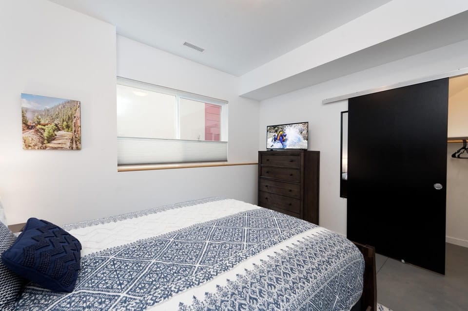 Durango, CO Vacation Rental Townhome - Bedroom with queen size bed, tv, clothes dresser, closet