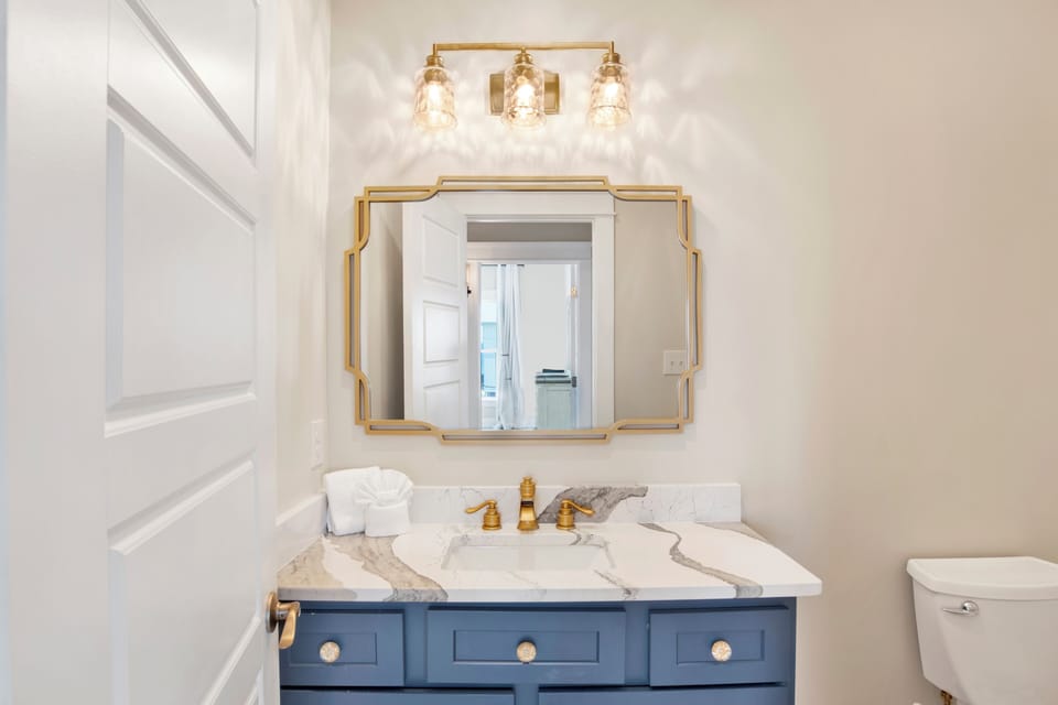 The living room has a half bathroom