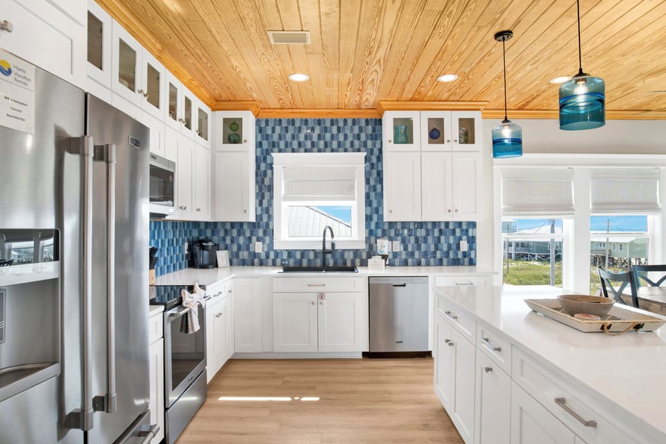 Fully equipped kitchen with stainless steel appliances and granite counters