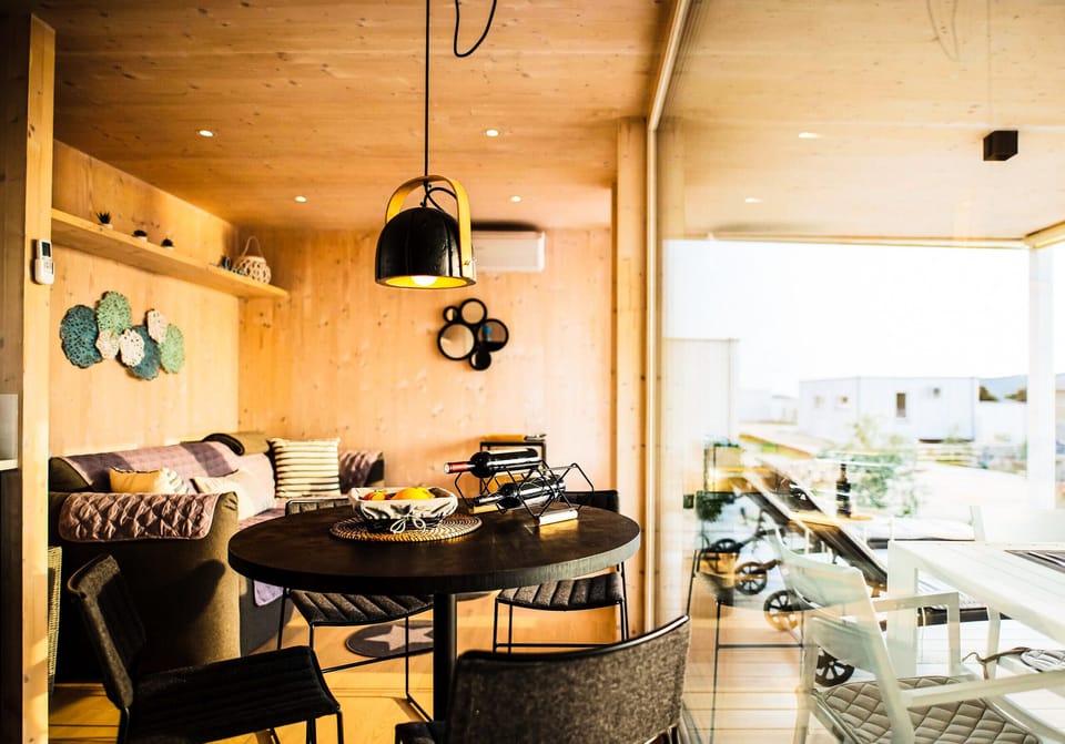 The comfortably furnished living room also has an outside view of the great sea.