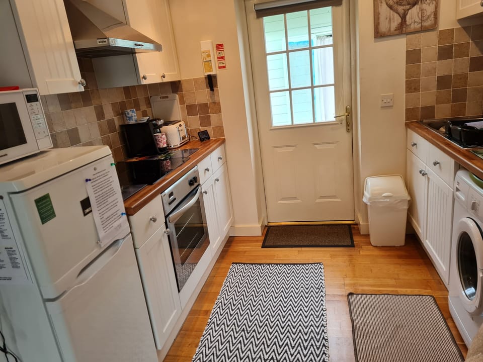 Villa | Private kitchen | Fridge, microwave, oven, stovetop