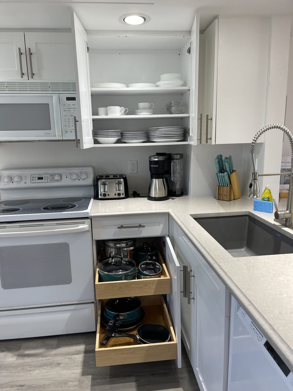 Fully stocked with coordinated dishware & nice Pots/Pans