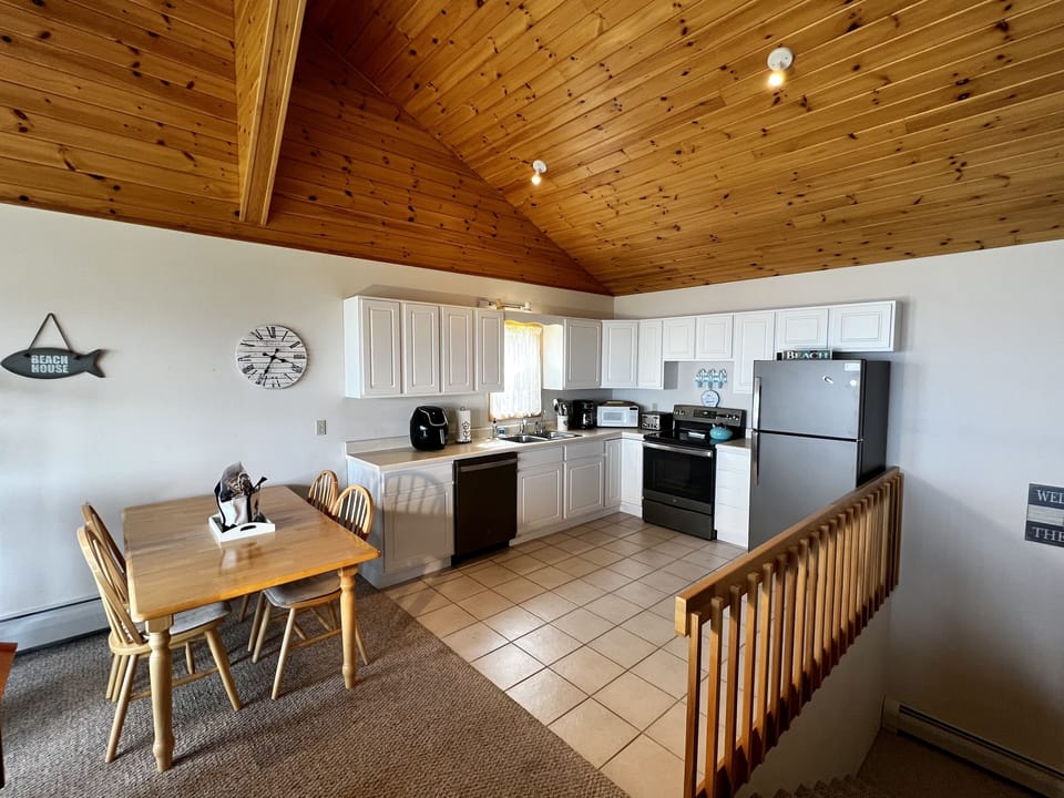 Open concept kitchen with 2023 updated GE appliances. 
