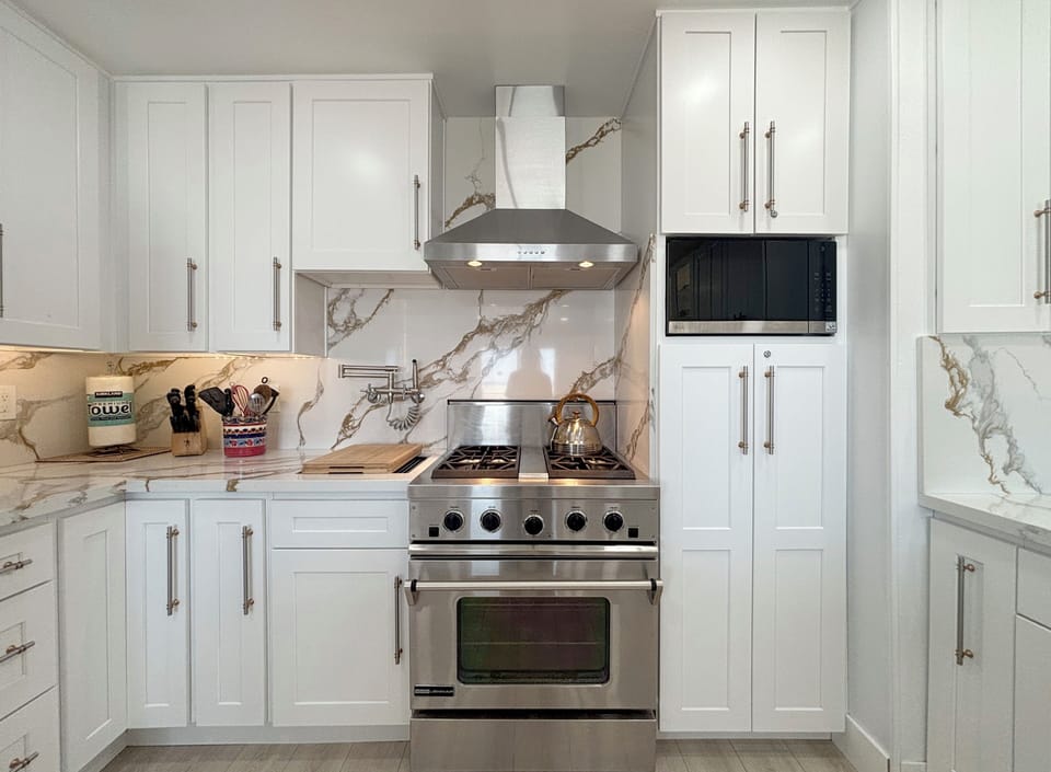 Upgraded appliances and extra vegetable sink, sprayer and pot filler.